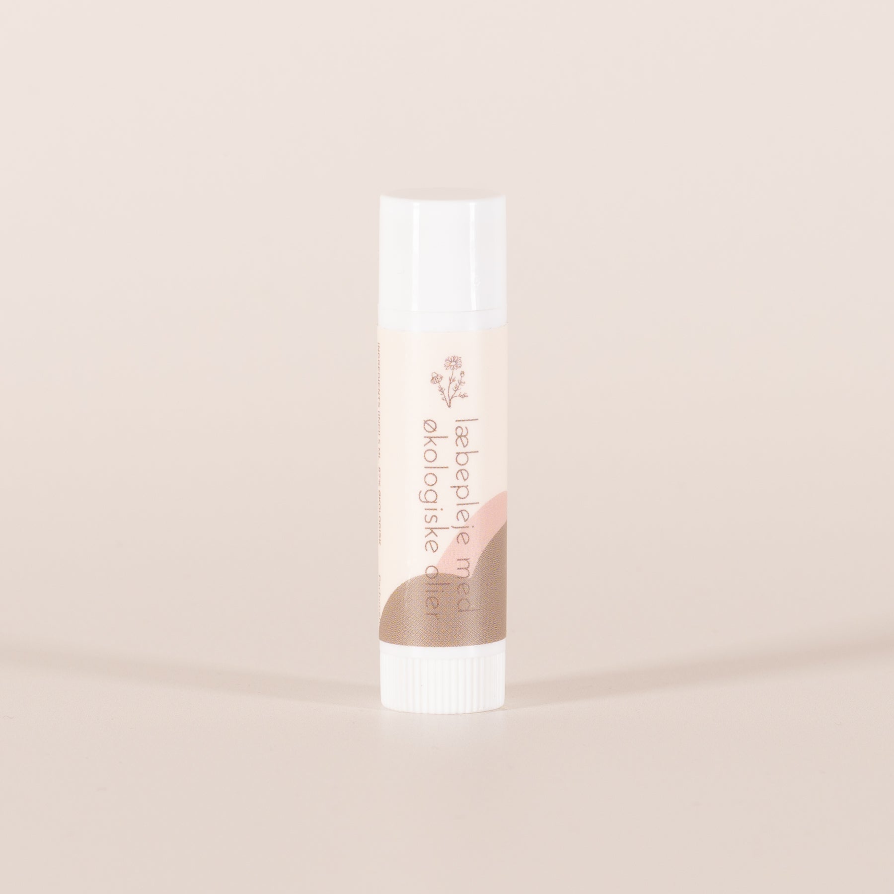 REN LYKKE læbepleje i lyserød emballage